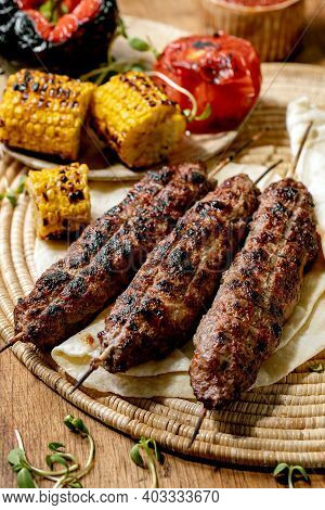 Eastern Fast Food. Grilled Beef Lyulya Kebab On Sticks On Flat Bread With Grilled Vegetables Sweet C