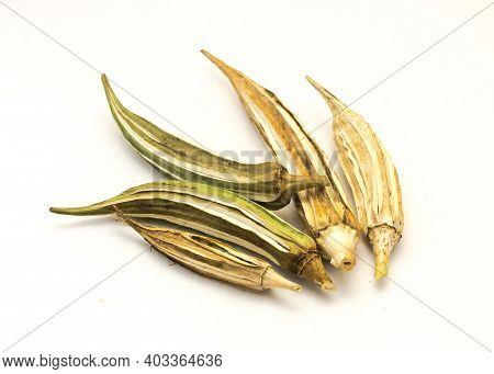 Five Matured And Dried Okra Pod For Saving Seeds Studio Shot Isolated On White Background