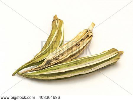 Three Matured And Dried Okra Pod For Saving Seeds Studio Shot Isolated On White Background