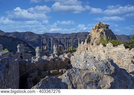 Interior Of A Medieval Fortress Facing The Mountains With Defense And Surveillance Towers Located In