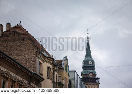 Close Up On The Clock Tower Of The Subotica City Hall, In Serbia, At Sunset. Also Called Gradska Kuc