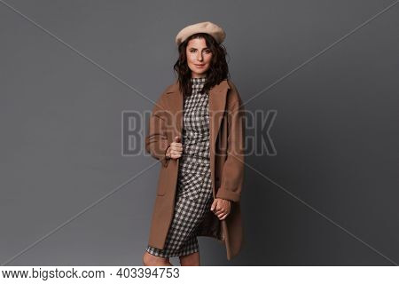 Young Elegant Woman In Stylish Spring Outfit Isolated On The Grey Background. Model Woman In Dress, 