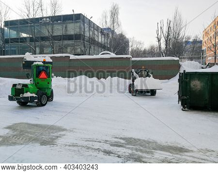 Moscow. Russia. January 15, 2021. Small Front-end Loaders Clear Snow From The Street And Load Into A