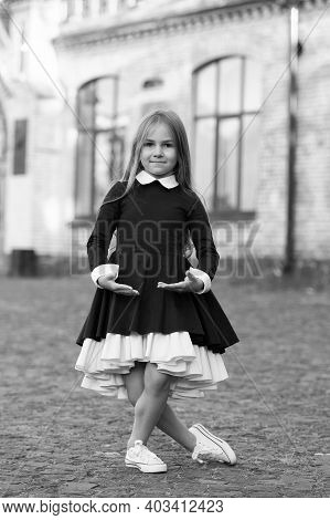 Plie Style Stance. Little Ballerina Wear School Uniform. Small Ballet Dancer Outdoors. Ballet School