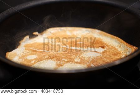 Pancake On Frying Pan. Making Of Pancakes.