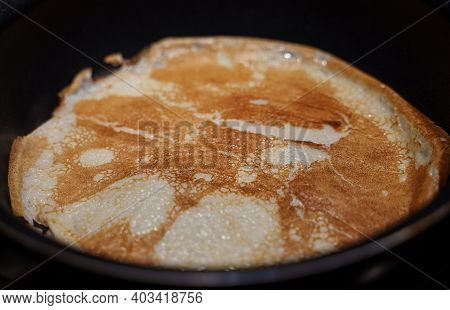 Pancake On Frying Pan. Making Of Pancakes.