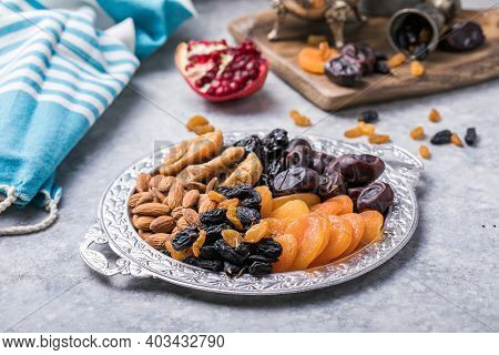 Dried Fruits And Nuts Mix In A Wooden Bowl. Assortment Of Candied Fruits. Judaic Holiday Tu Bishvat.