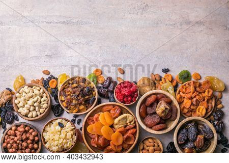 Dried Fruits And Nuts Mix In A Wooden Bowl. Assortment Of Candied Fruits. Judaic Holiday Tu Bishvat.