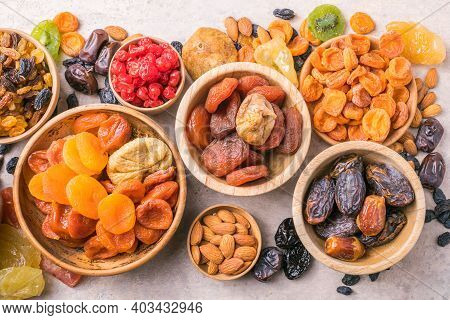 Dried Fruits And Nuts Mix In A Wooden Bowl. Assortment Of Candied Fruits. Judaic Holiday Tu Bishvat.
