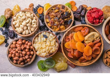 Dried Fruits And Nuts Mix In A Wooden Bowl. Assortment Of Candied Fruits. Judaic Holiday Tu Bishvat.
