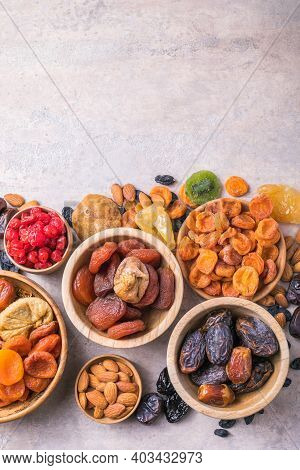 Dried Fruits And Nuts Mix In A Wooden Bowl. Assortment Of Candied Fruits. Judaic Holiday Tu Bishvat.