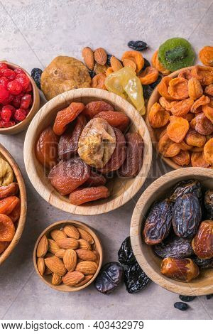 Dried Fruits And Nuts Mix In A Wooden Bowl. Assortment Of Candied Fruits. Judaic Holiday Tu Bishvat.