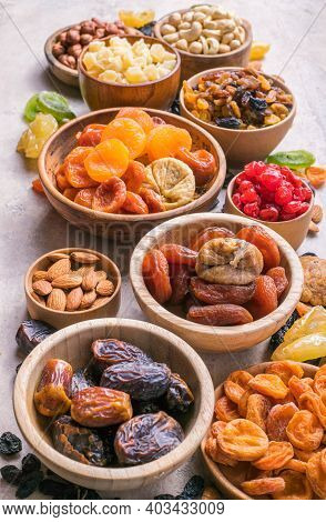 Assortment Of Nuts And Dried Fruits. Dried Fruits And Nuts Mix In A Wooden Bowl. Assortment Of Candi
