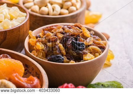 Dried Fruits And Nuts Mix In A Wooden Bowl. Assortment Of Candied Fruits. Judaic Holiday Tu Bishvat.
