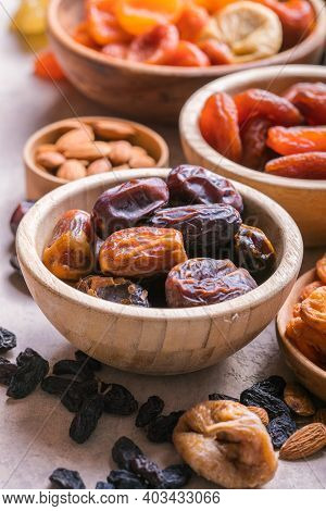 Dried Fruits And Nuts Mix In A Wooden Bowl. Assortment Of Candied Fruits. Judaic Holiday Tu Bishvat.