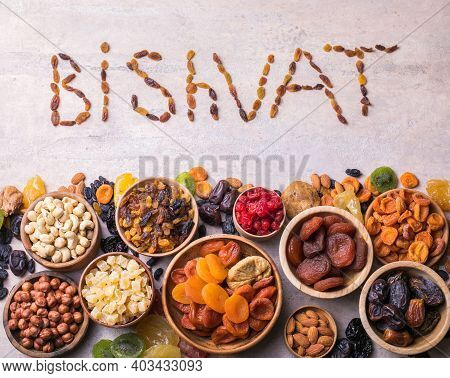 Dried Fruits And Nuts Mix In A Wooden Bowl. Assortment Of Candied Fruits. Judaic Holiday Tu Bishvat.
