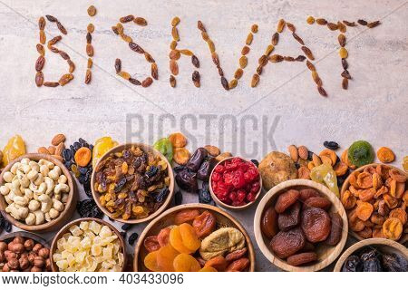 Dried Fruits And Nuts Mix In A Wooden Bowl. Assortment Of Candied Fruits. Judaic Holiday Tu Bishvat.