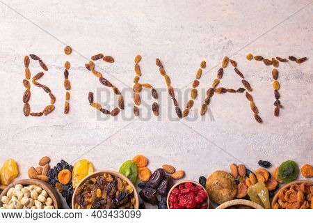 Dried Fruits And Nuts Mix In A Wooden Bowl. Assortment Of Candied Fruits. Judaic Holiday Tu Bishvat.