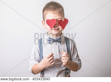Five Year Old Smiling Boy Holding A Red Heart On Eays  Symbol Of Love, Family, Hope. Backgrounds For