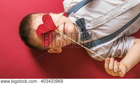 Five Year Old Smiling Boy Holding A Red Heart On Eays  Symbol Of Love, Family, Hope. Backgrounds For