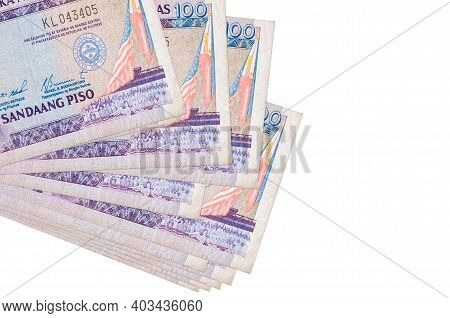 100 Philippine Piso Bills Lies In Small Bunch Or Pack Isolated On White. Mockup With Copy Space. Bus