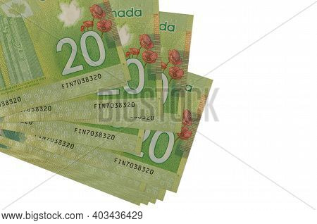 20 Canadian Dollars Bills Lies In Small Bunch Or Pack Isolated On White. Mockup With Copy Space. Bus