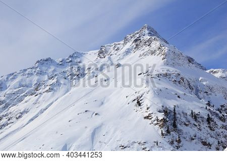 Aperes Schareck Mountain Peak In Austria. Goldberg Group Of Austrian Alps. Winter Landscape.