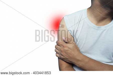 Close Up Asian Man Holding Up White Shirt Sleeve To Show The Sticking Plaster After Injection Vaccin
