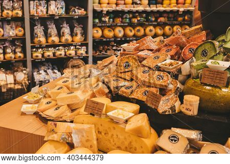 Gouda, Netherlands - July 20, 2020: Many Different Kinds Large Delicious Hunks Of Cheese On The Shel