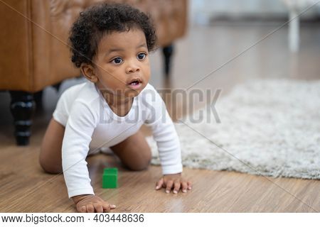 Happy African American Little Baby Boy Crawling And Looking For Some Thing To Learn
