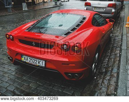 Kiev, Ukraine - April 10, 2011: Red Supercar Ferrari F430 In Raindrops. Ferrari In The City