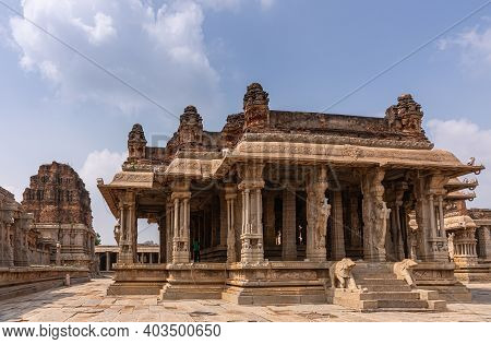 Hampi, Karnataka, India - November 5, 2013: Vijaya Vitthala Temple. Group Of Brown Stone Sanctuaarie
