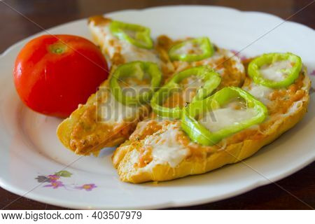 Hot Sandwich, Crescent Filled With Parizer Cream On A Dish