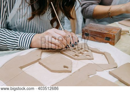 Womens Hands Knead Clay, Drawing Elements Of The Product. Production Of Ceramic Products At The Mast