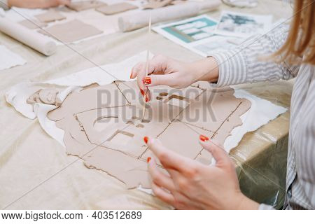 Womens Hands Knead Clay, Drawing Elements Of The Product. Production Of Ceramic Products At The Mast