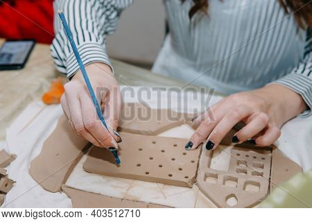 Womens Hands Knead Clay, Drawing Elements Of The Product. Production Of Ceramic Products At The Mast