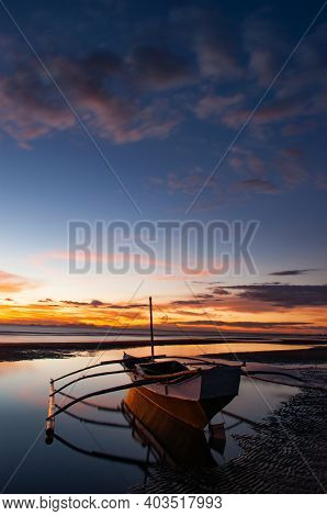 Boat sunset blue skies sea sikly waters