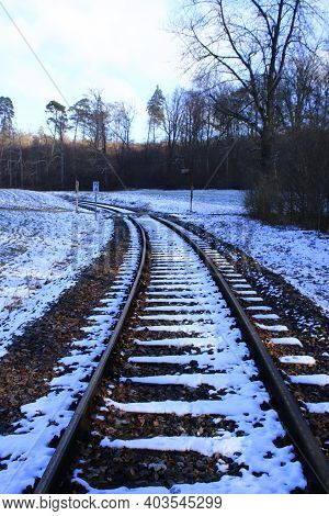 Railway Tracks Run Away From The Viewer In A Curve