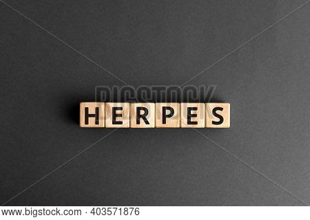 Herpes - Word From Wooden Blocks With Letters, Viral Diseases Herpes Viruses Concept, Grey Backgroun