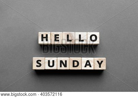 Hello Sunday - Words From Wooden Blocks With Letters, Hello Sunday Concept, Top View Gray Background
