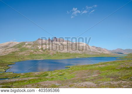 Gaesavatn Lake And The Mountains Of Borgarfjordur And Breidavik In Iceland