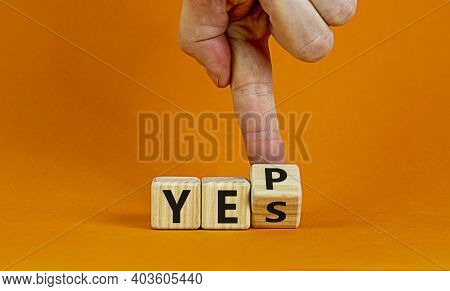 Yes Or Yep Symbol. Businessman Turns A Cube, Changes The Word 'yes' To 'yep'. Beautiful Orange Backg