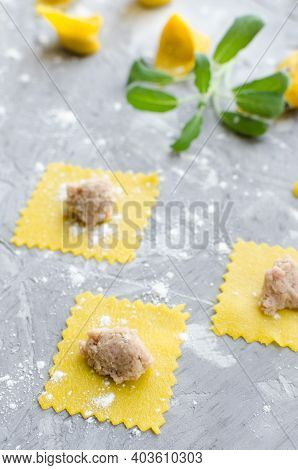 Proccess Of Making Tortellini. Freshly Prepared Homemade Raw Tortellini. Traditional Italian Cuisine