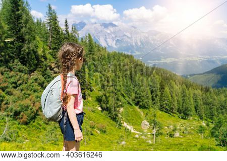 Children Hiking On Beautiful Summer Day In Alps Mountains Austria, Resting On Rock And Admire Amazin