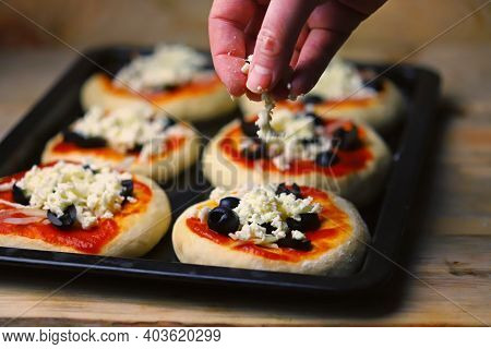 Mini Pizza Cooking. Home-made Fast Food. Soft Focus.