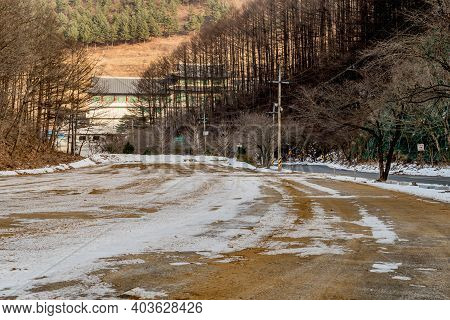Danyang-gun, South Korea; Jan. 13, 2021: Winter Landscape Of Road To Guinsa Temple In Background.