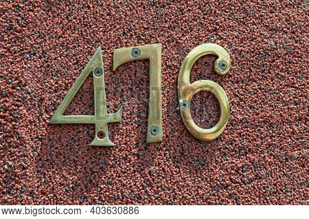 House Number Plate 476 On A Wall. Street Number. Address Number.