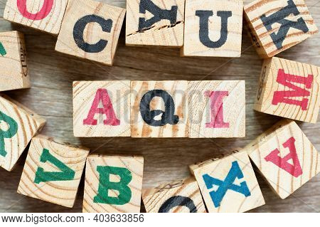 Alphabet Letter Block In Word Aqi (abbreviation Of Air Quality Index) With Another On Wood Backgroun