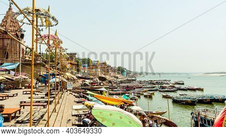 Varanasi, India - May 06, 2019 - A View Of Historic Varanasi Ghats, Ancient Temples And Buildings Al