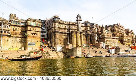 Varanasi, India - May 06, 2019 - A View Of Historic Varanasi Ghats, Ancient Temples And Buildings Al